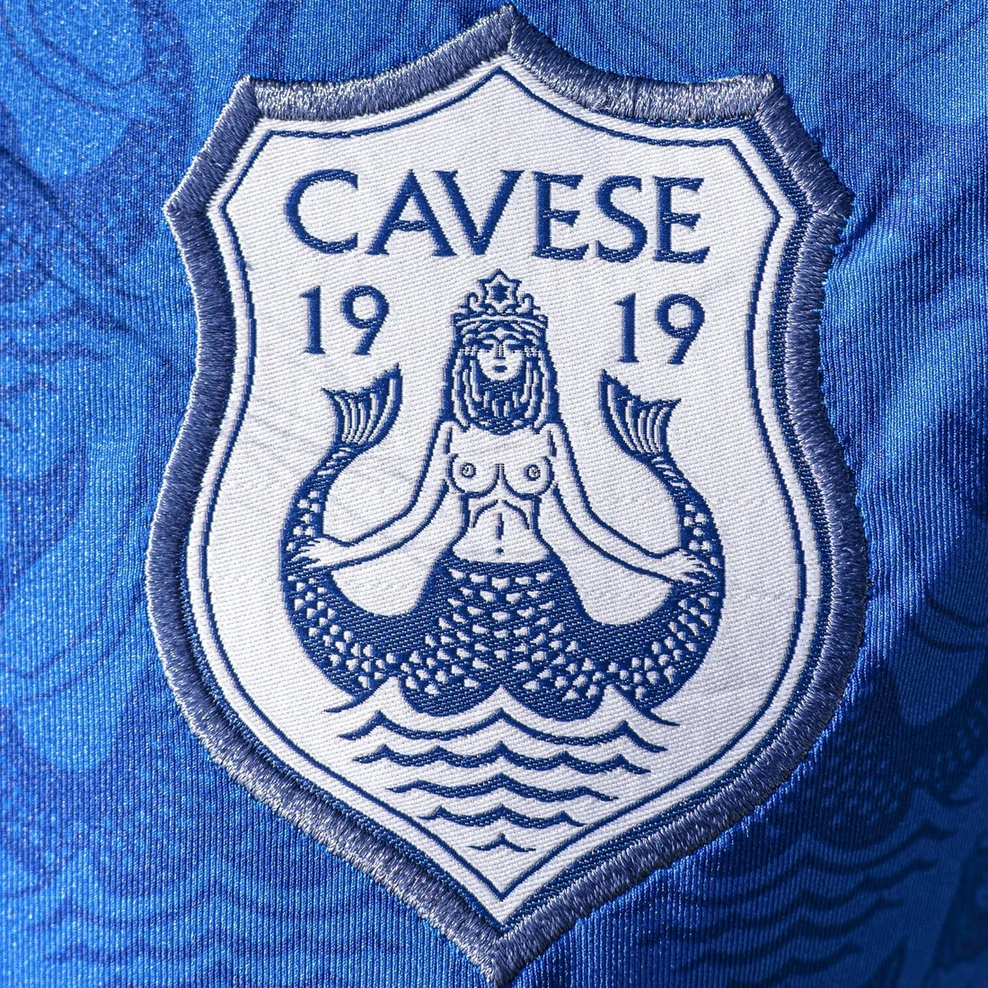Woven patch — The crest woven as its own badge, then applied.