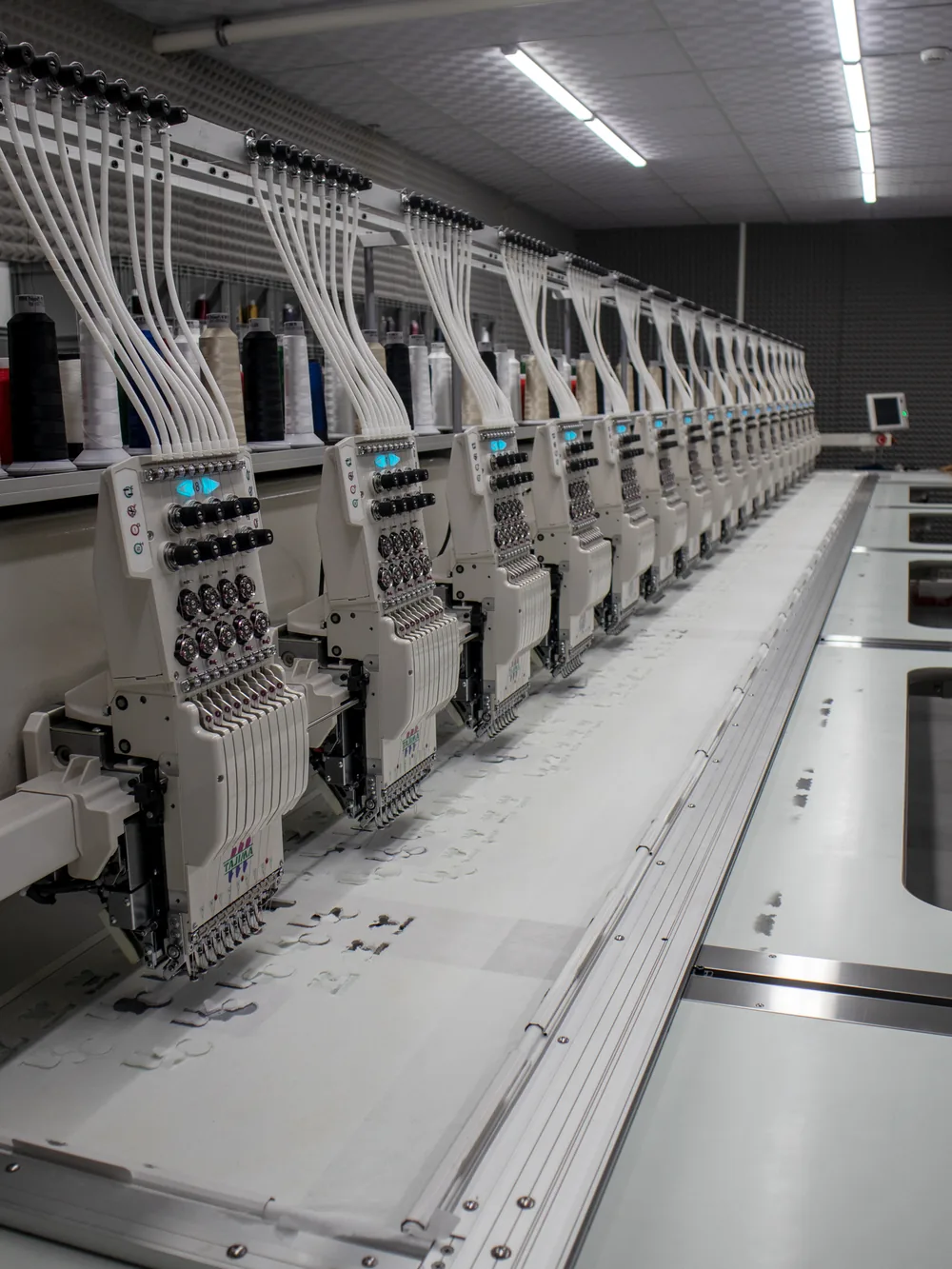 Multi-head embroidery machine line threaded and running