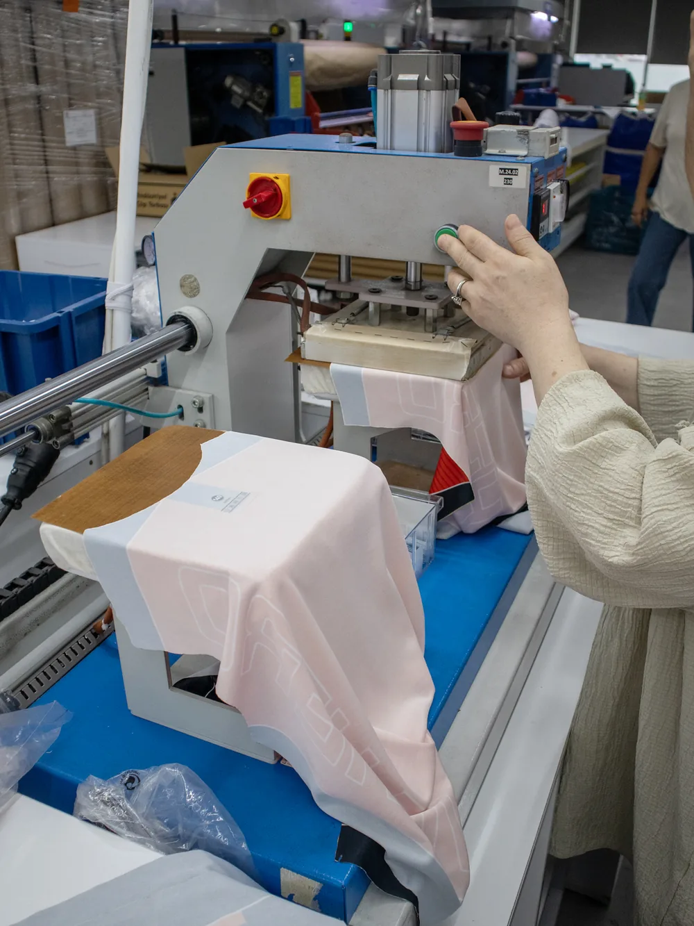 Heat press bonding the printed transfer into the fabric
