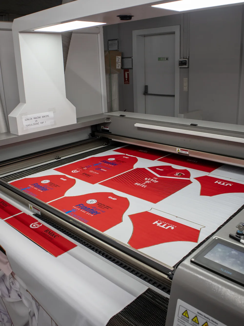 Printed kit panels with sponsor blocks on the laser bed